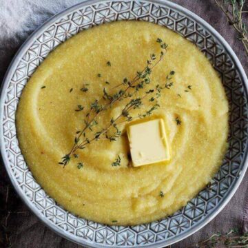 easy polenta in bowl with slab of butter