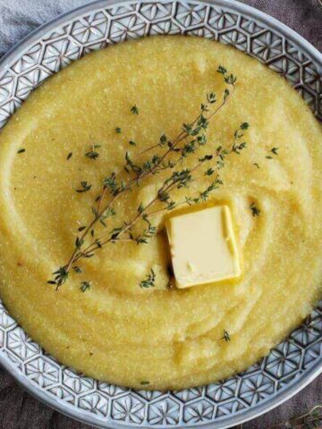 easy polenta in bowl with slab of butter