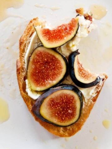 fig and cream cheese toast with bite taken out