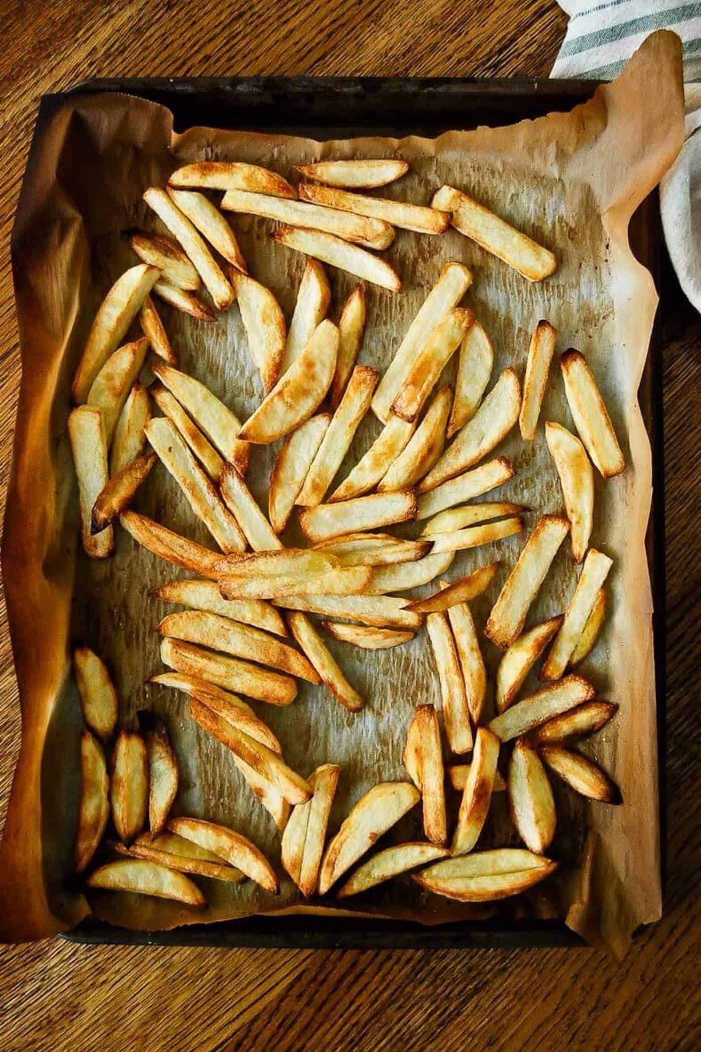oven baked fries on pan.