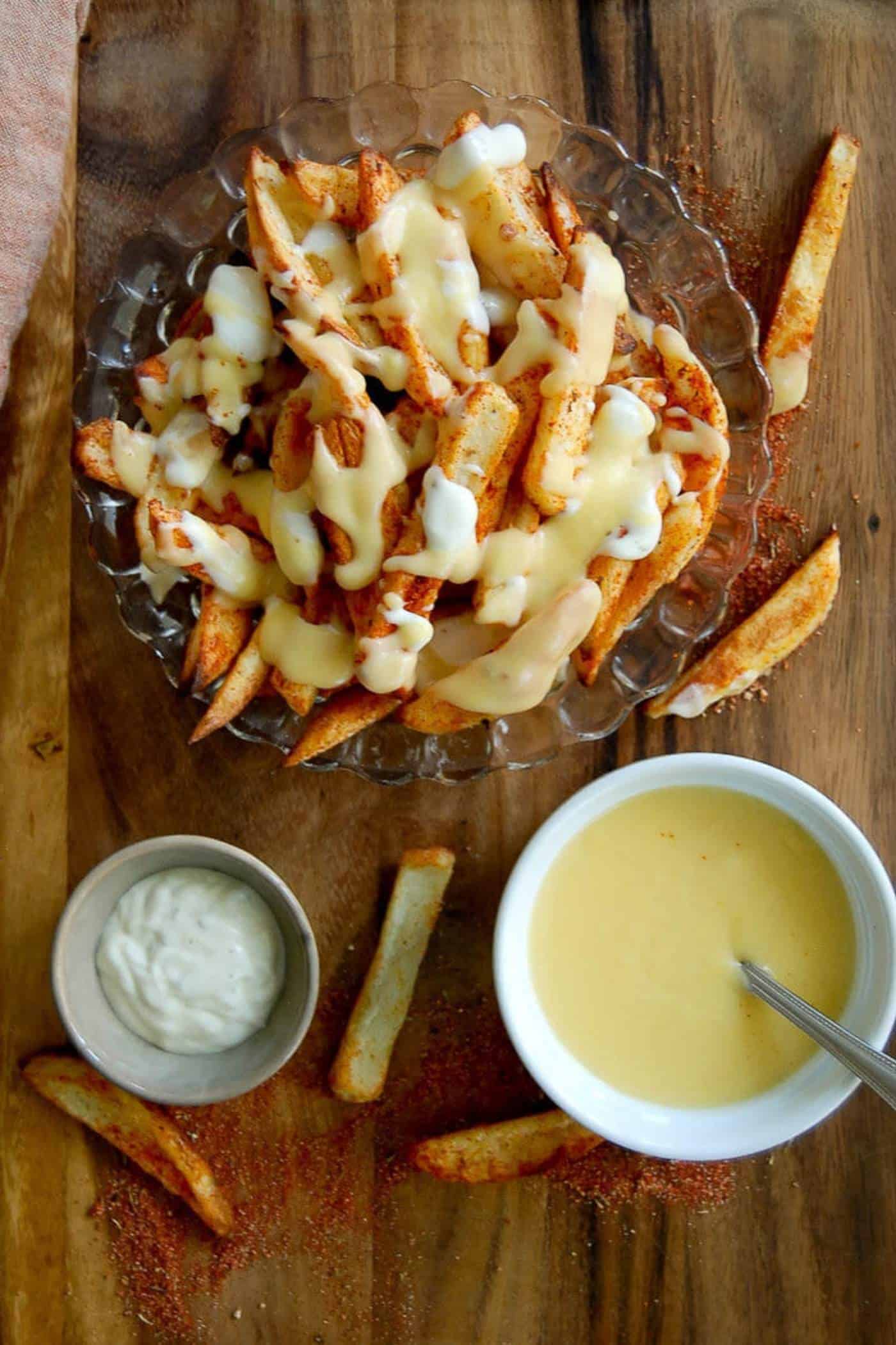 louisiana voodoo fries with cajun seasoning, ranch dressing and cheese sauce.