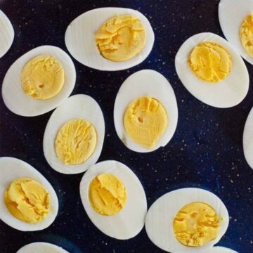 perfect hard boiled eggs, halved, on tray.