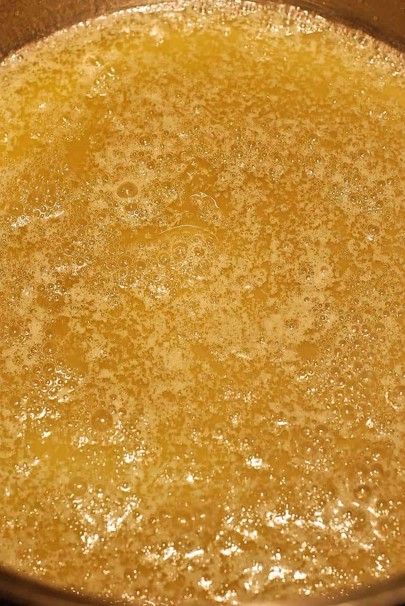 caramel sauce simmering on stove.