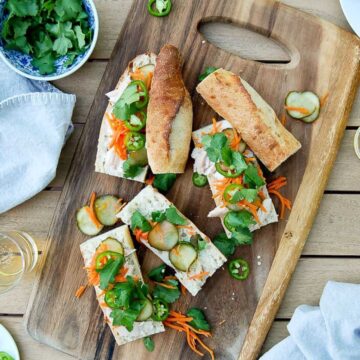 rotisserie chicken banh mi sandwiches on cutting board