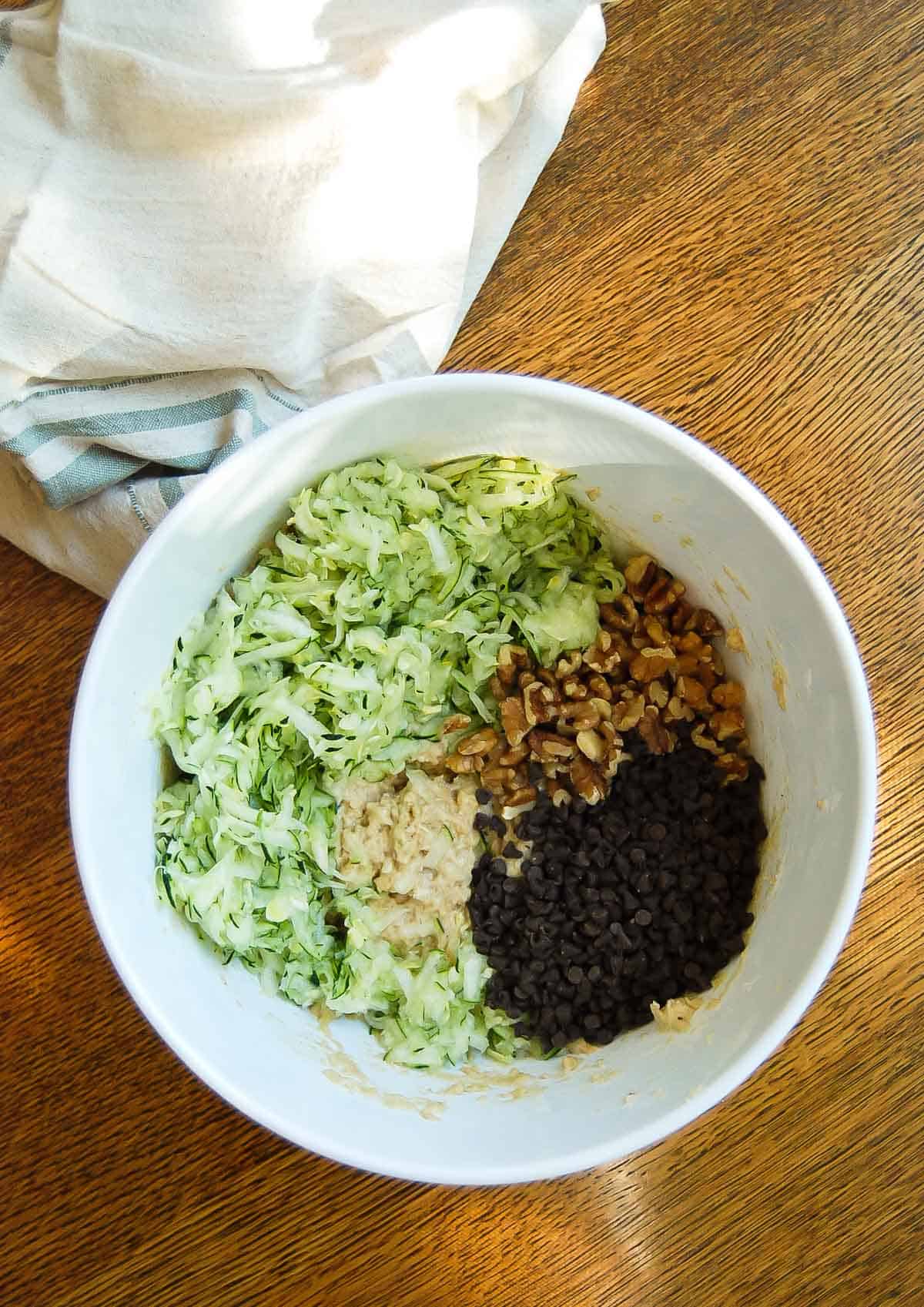 mixed ingredients for zucchini chocolate chip muffins