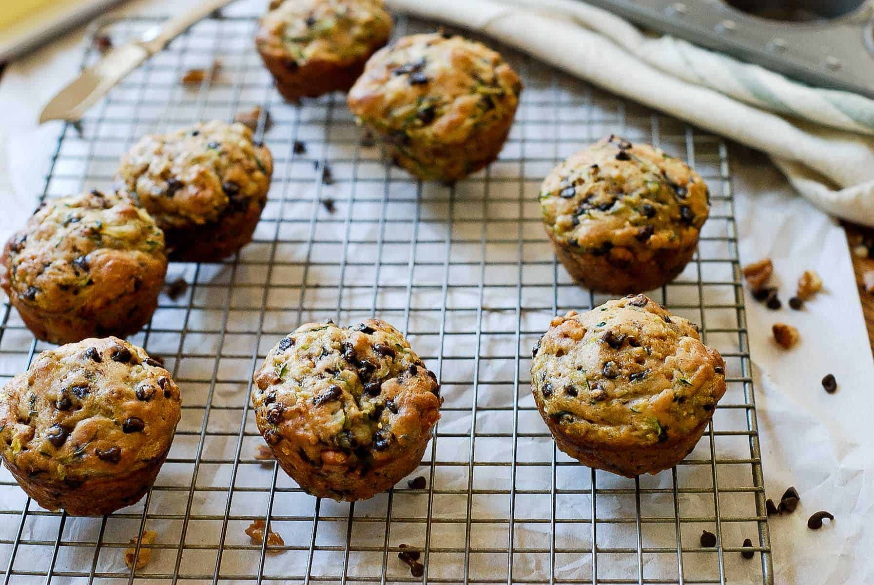 zucchini chocolate chip muffins on cooling rack close up