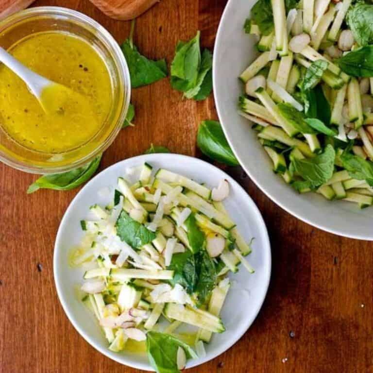 chopped zucchini and herb salad with parmesan on plate.