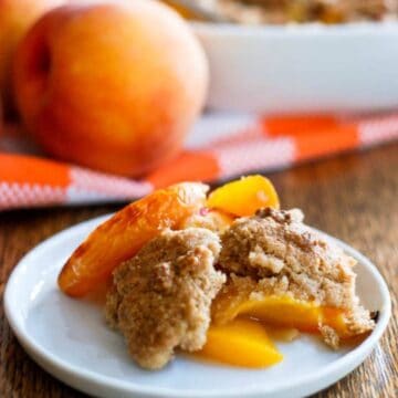 peach cobbler slice on plate.
