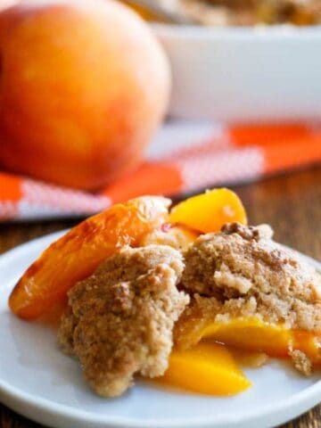 peach cobbler slice on plate.