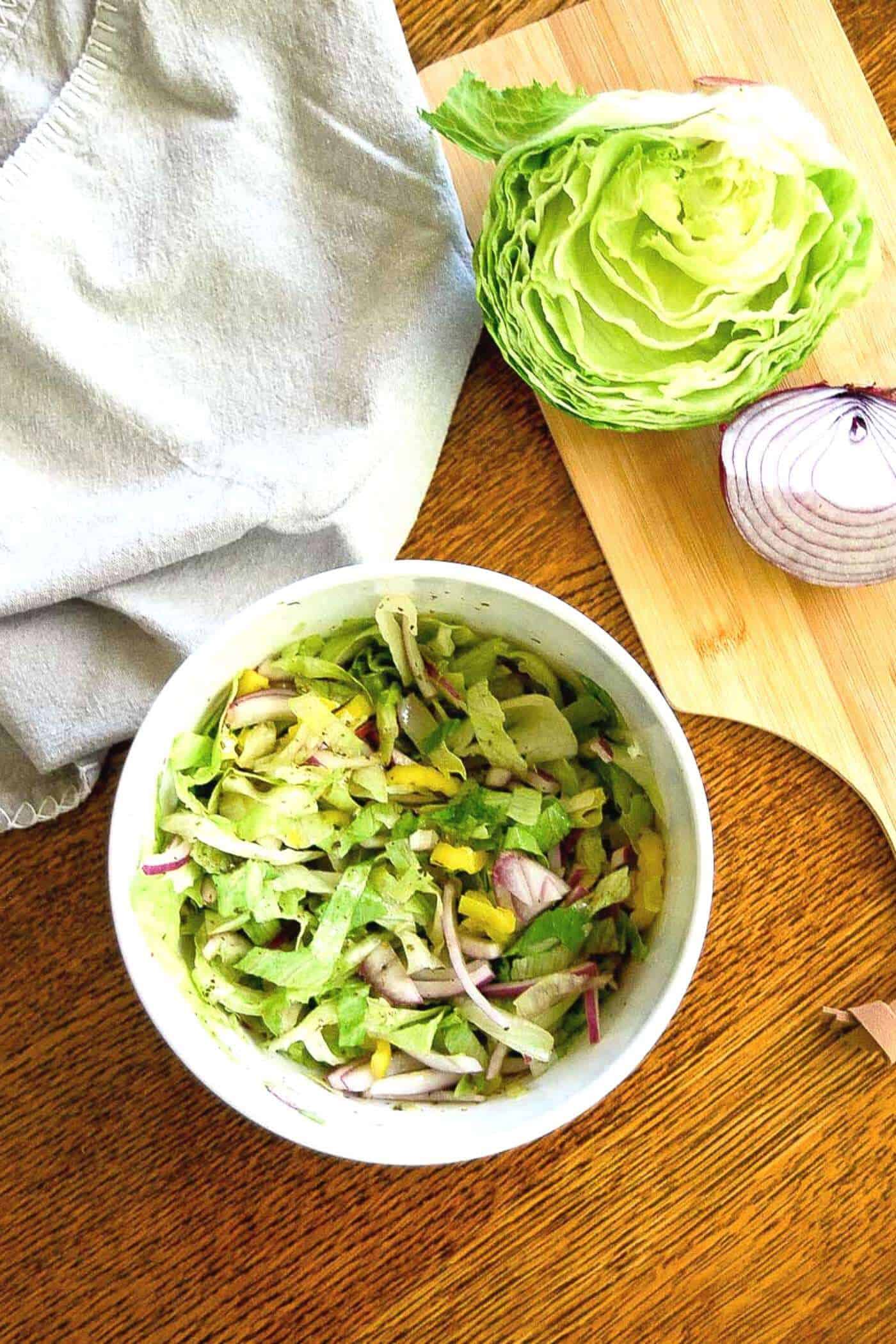 grinder salad mix in bowl for grinder sandwich recipe.