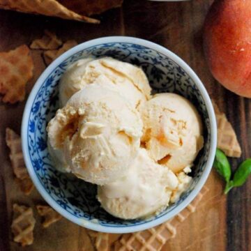 peach ice cream in bowl.