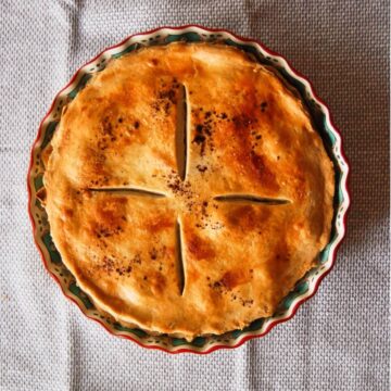 perfect peach pie in pie pan.
