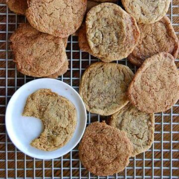 big soft ginger cookies on cooling rack.