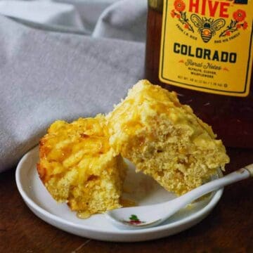 cornbread slices on plate with honey.