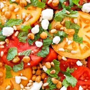 tomato and grain salad with feta and pine nuts closeup.