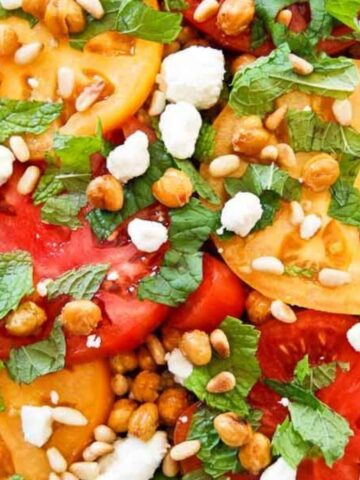 tomato and grain salad with feta and pine nuts closeup.