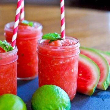 watermelon cucumber mint slushie in cup with straw.