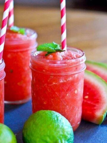 watermelon cucumber mint slushie in cup with straw.