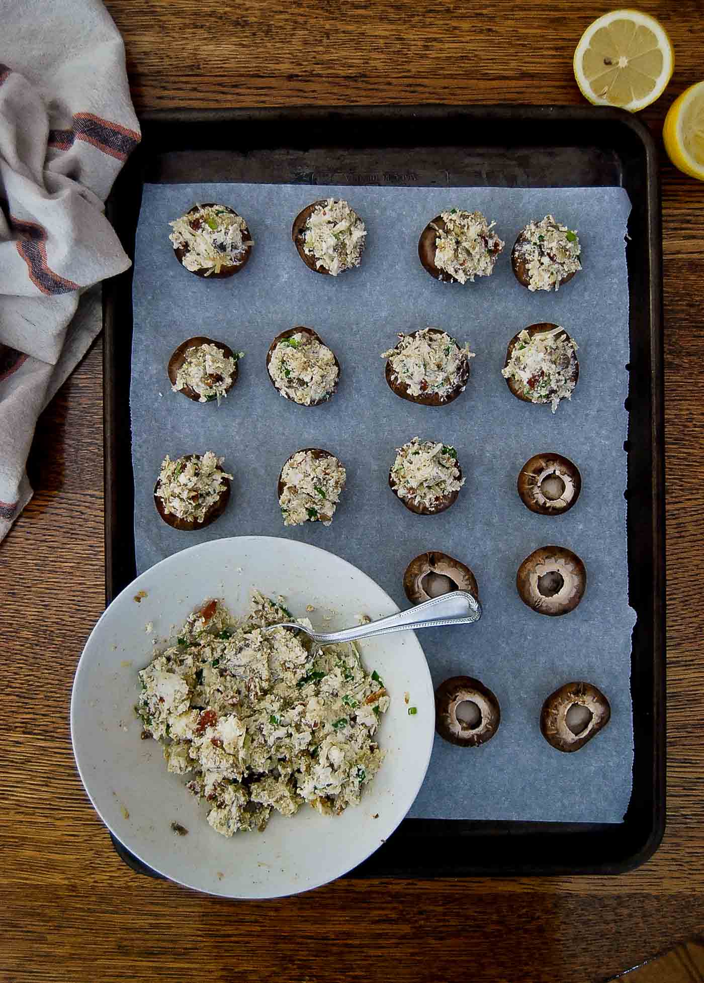 stuffed mushrooms on baking tray pre bake.