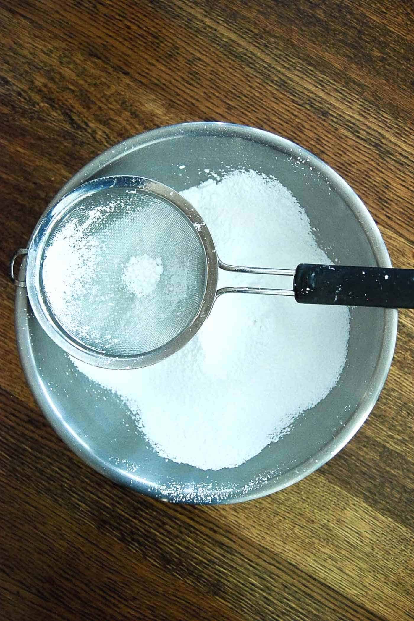 sifted powdered sugar in bowl.