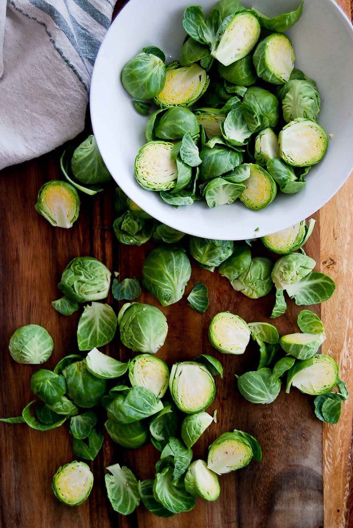cut brussels sprouts on cutting board.
