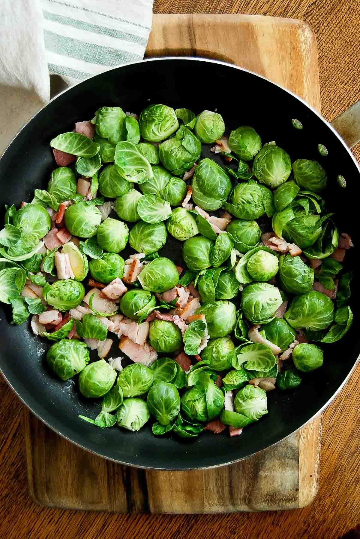 brussel sprouts with bacon in pan.