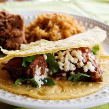 chicken mole tacos on plate.