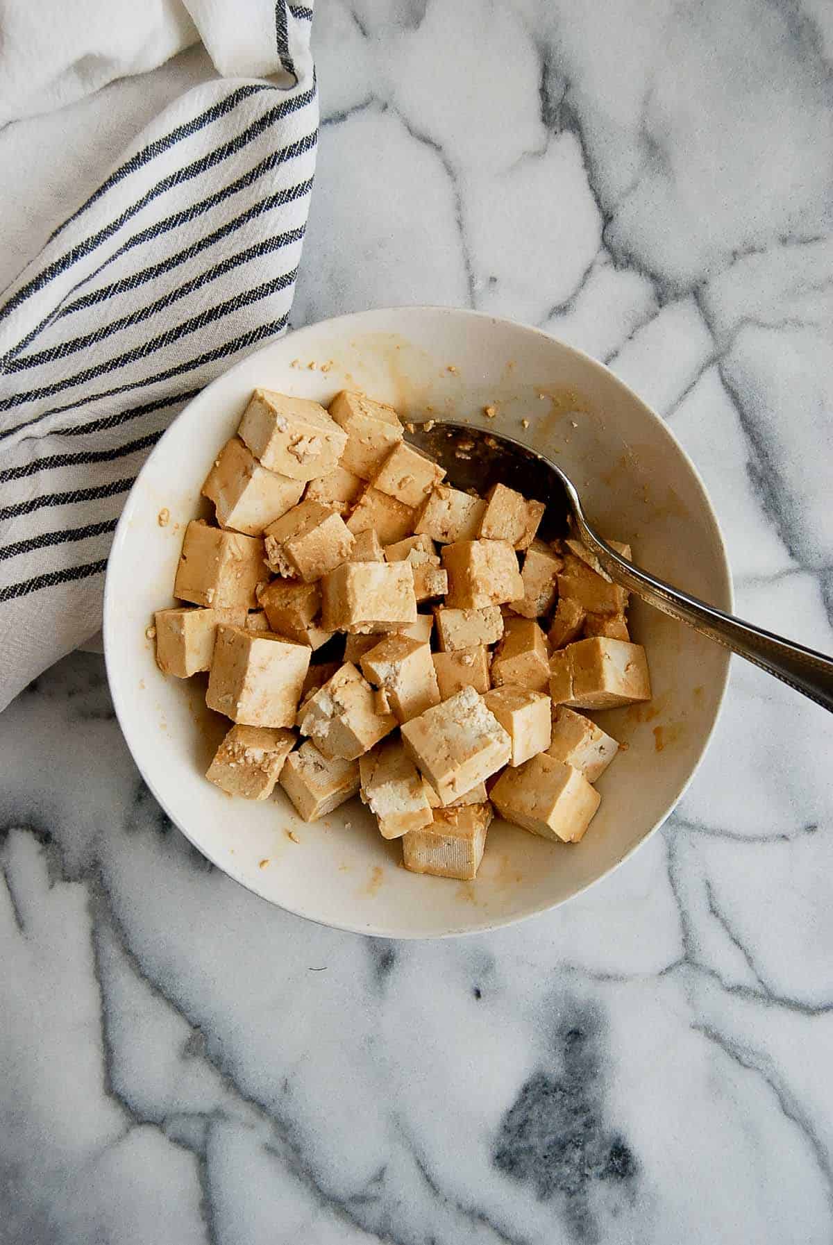 tofu tossed with soy sauce and cornstarch.