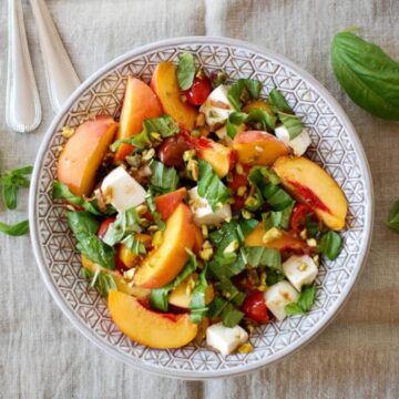 peach caprese salad in bowl.