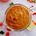 homemade red enchilada sauce in measuring cup.