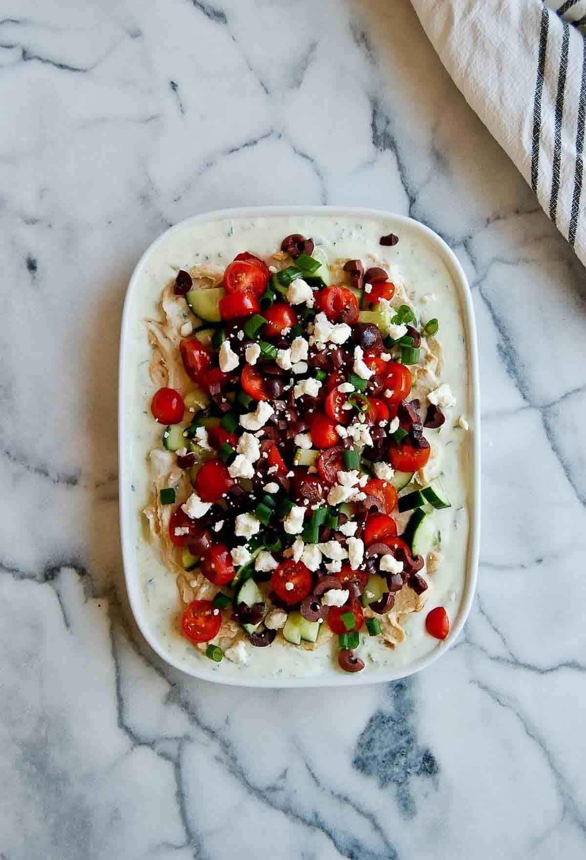 7 layer greek dip on platter.