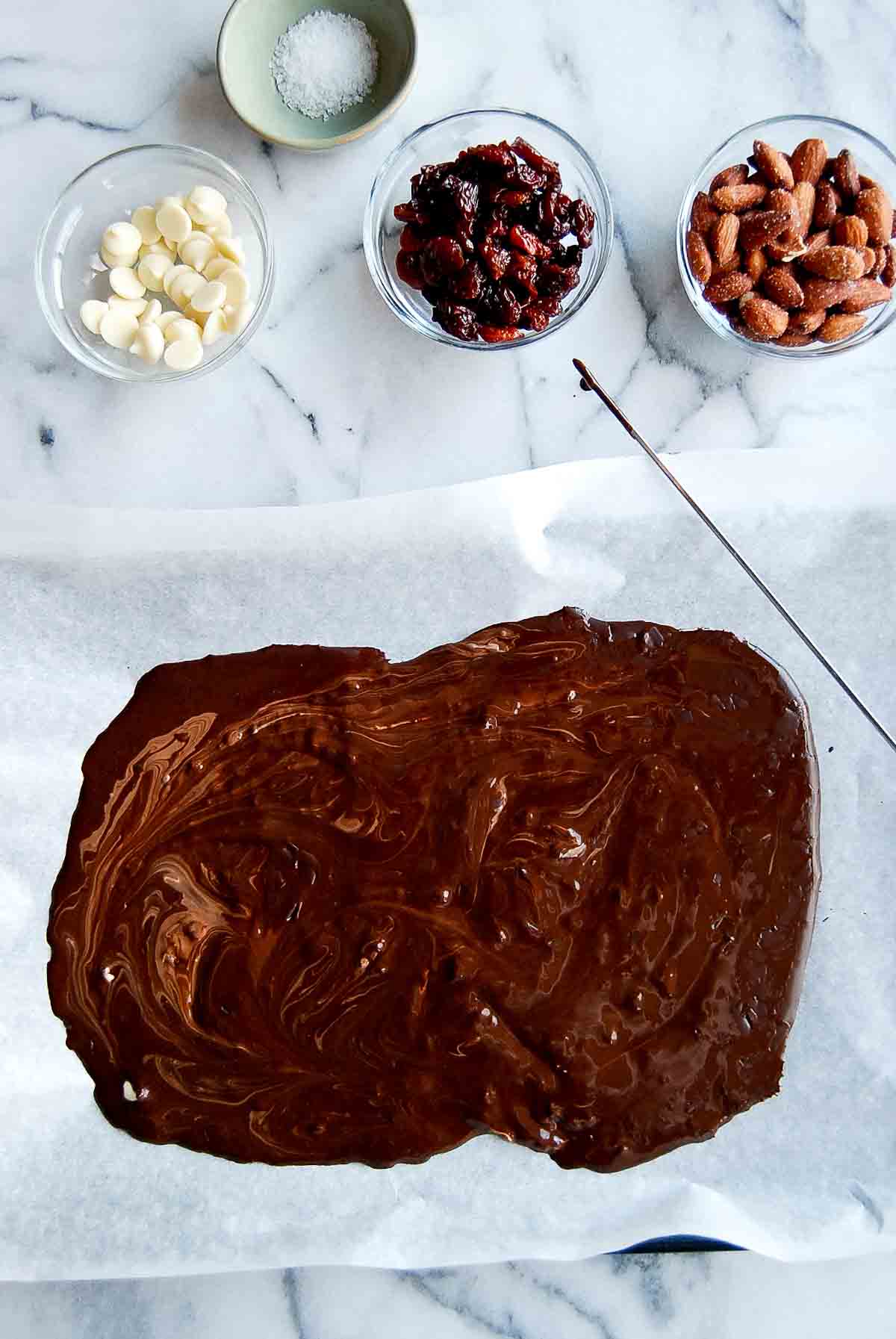 mixed melted chocolate bars on baking sheet.