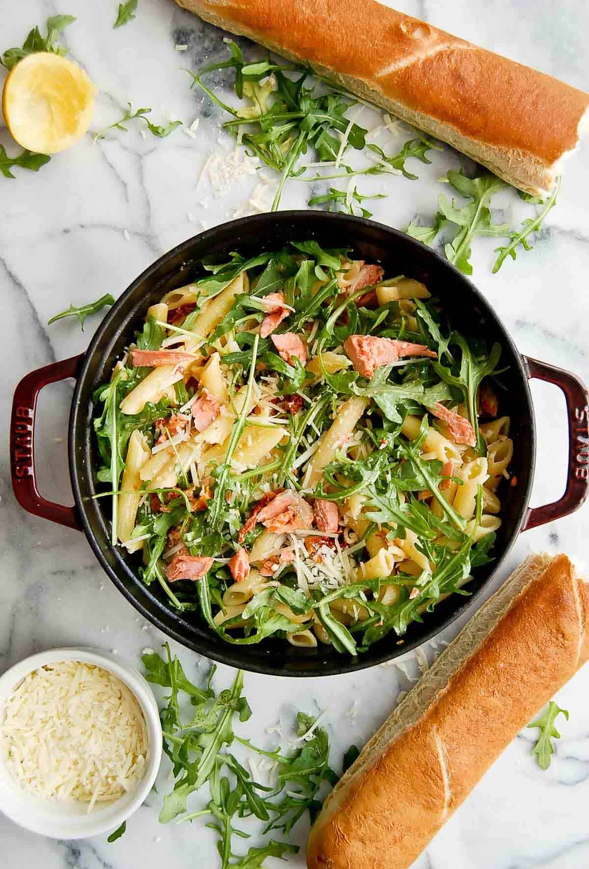 lemon salmon pasta in pot on cutting board