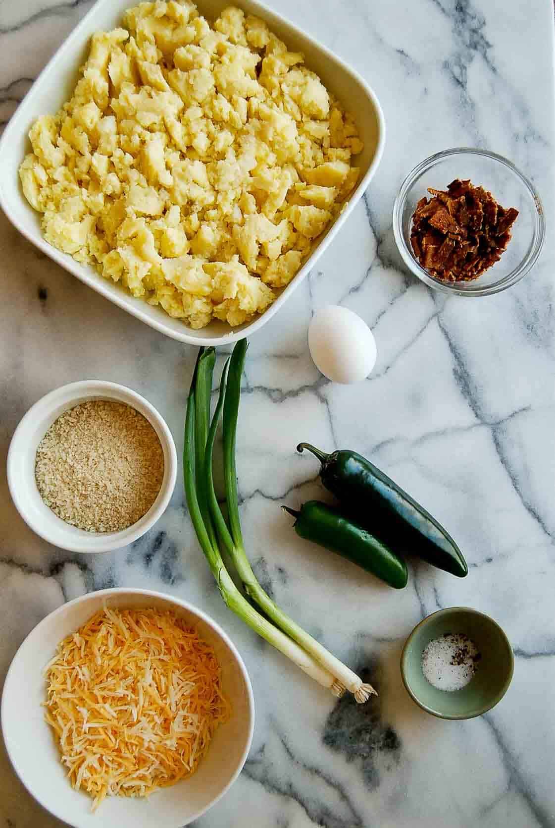 ingredients for fried mashed potato balls with bacon and cheese.