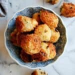 fried mashed potato balls in bowl.