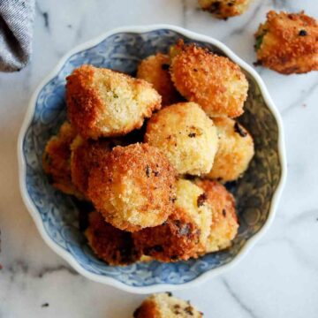 fried mashed potato balls in bowl.