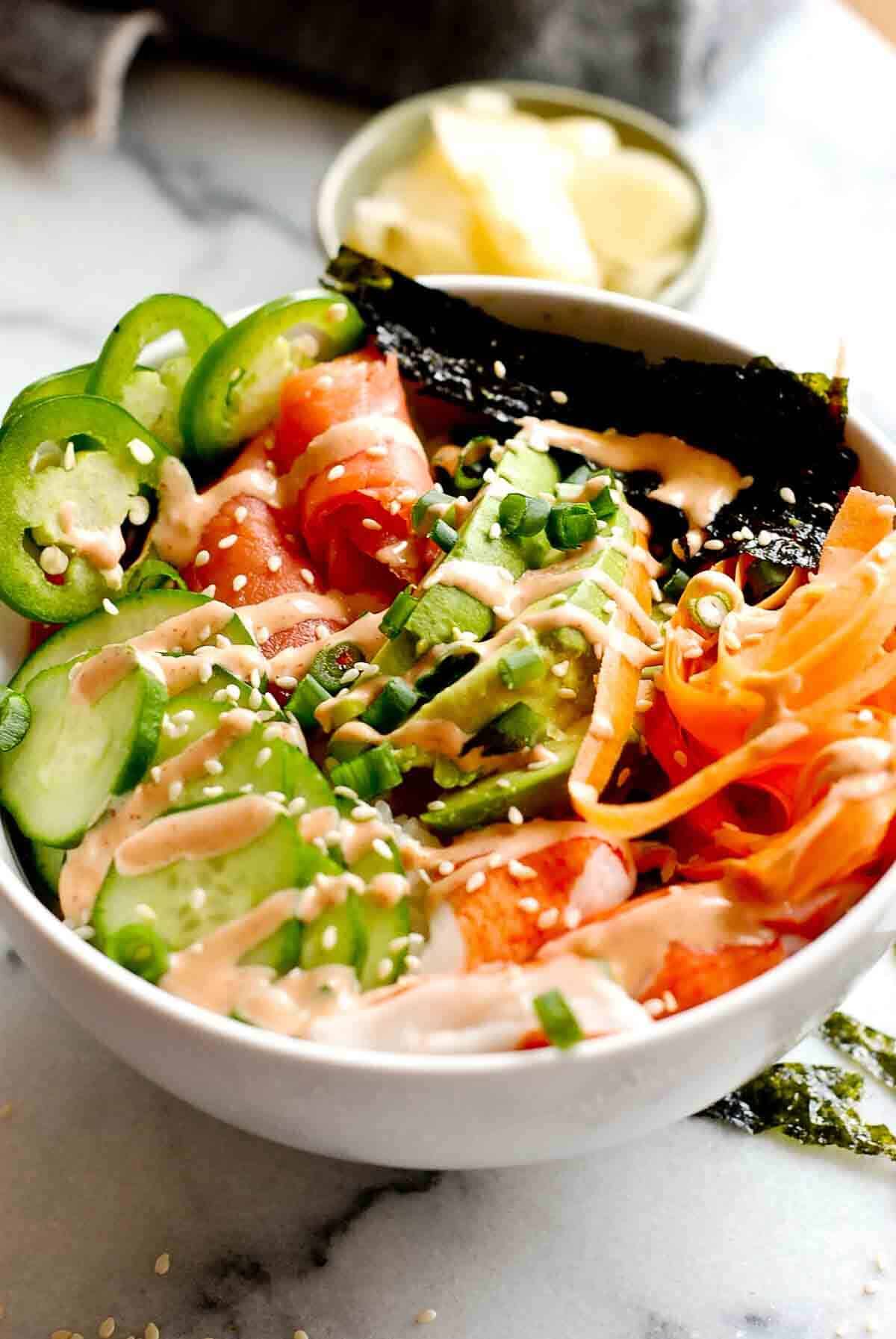 closeup of smoked salmon rice bowl with veggies.