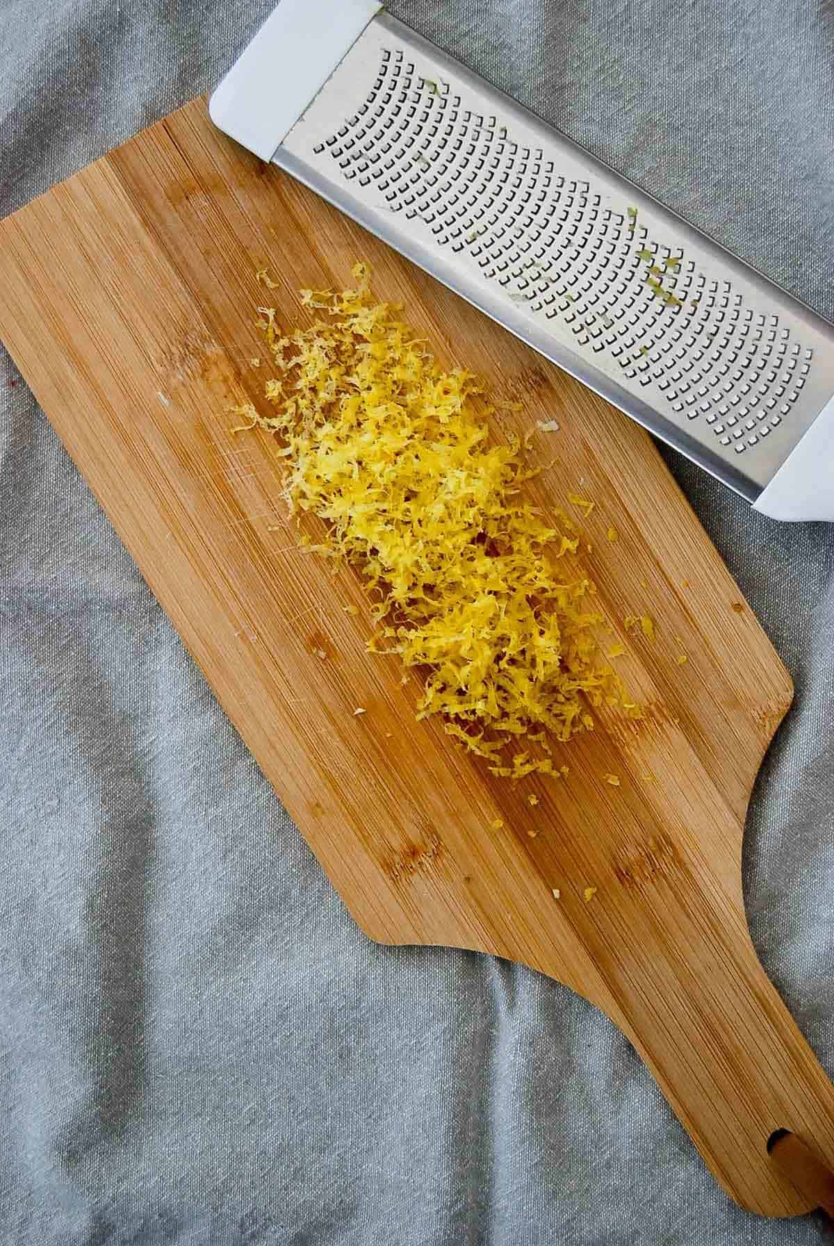grated lemon zest on a cutting board.