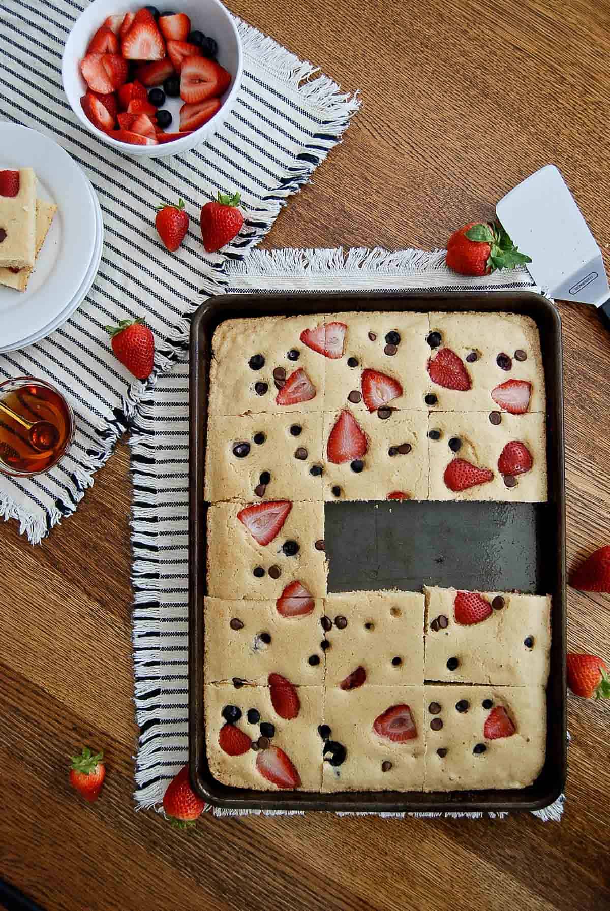 sheet pan with oven baked pancakes with two cut out.