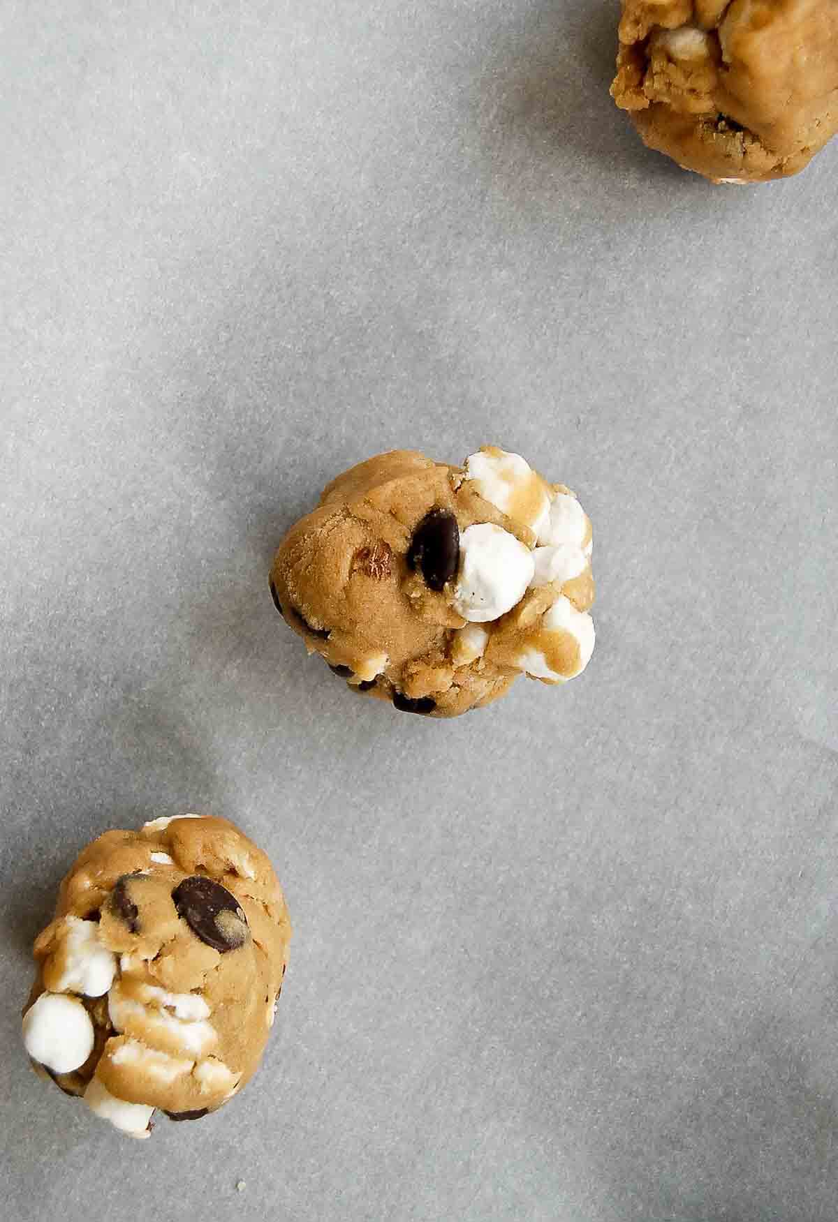 ball of chocolate chip marshmallow cookie dough on tray.