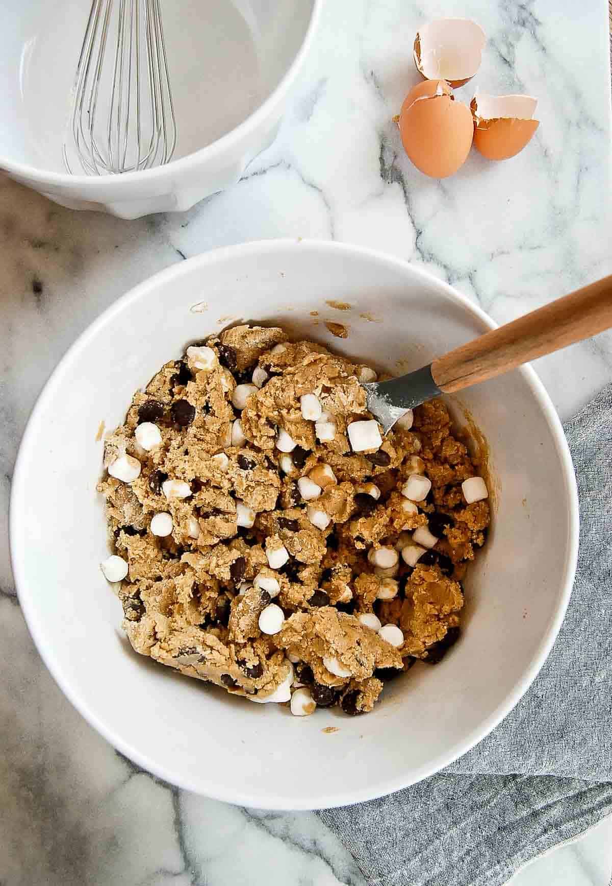 dough for chocolate chip marshmallow cookies in large bowl, mixed.