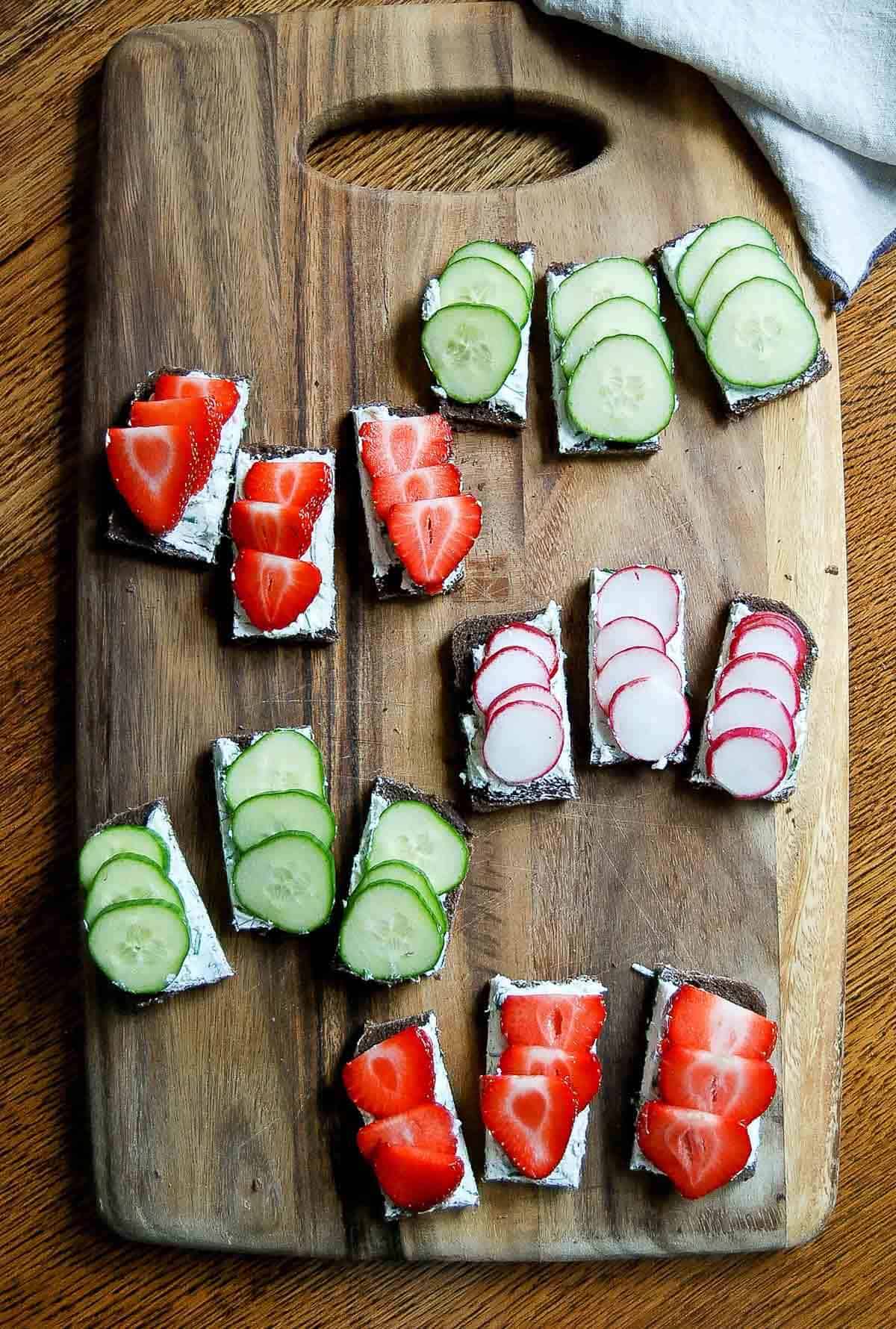 cut finger sandwiches on cutting board.