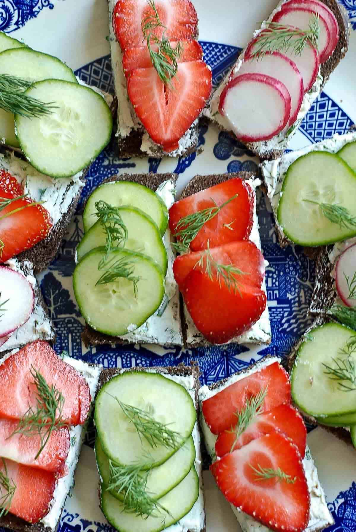 tea tree platter with cucumbers, strawberries, and radishes.