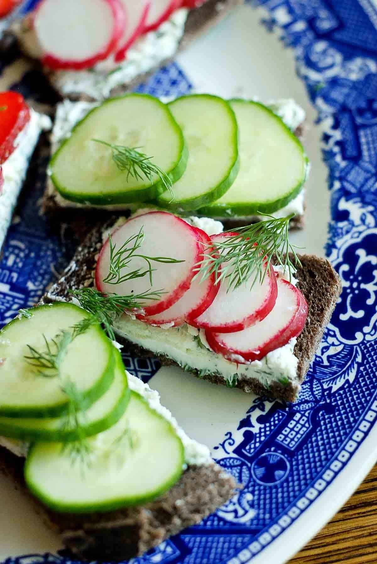 closeup of tea sandwich with radish and cream cheese.