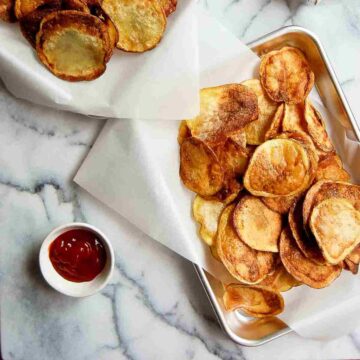 tray of homemade yukon chips with ketchup on the side.
