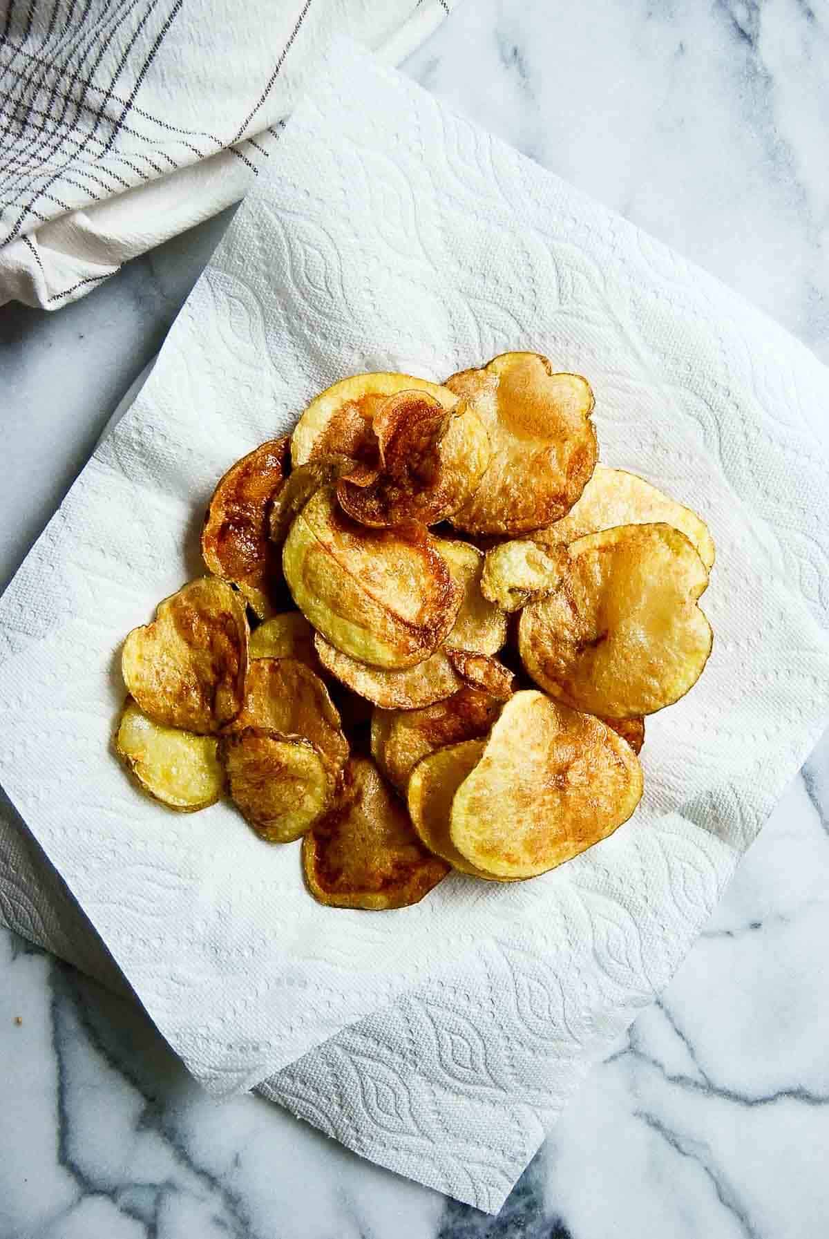 yukon chips cooling on a paper towel.