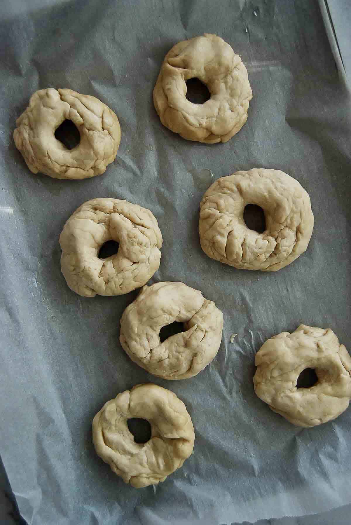 dough formed into bagel rings.