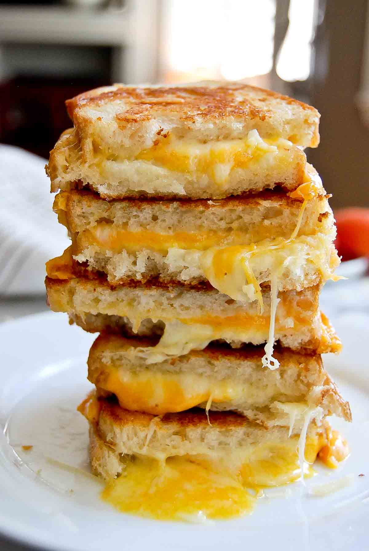 stack of sourdough grilled cheese sandwiches.
