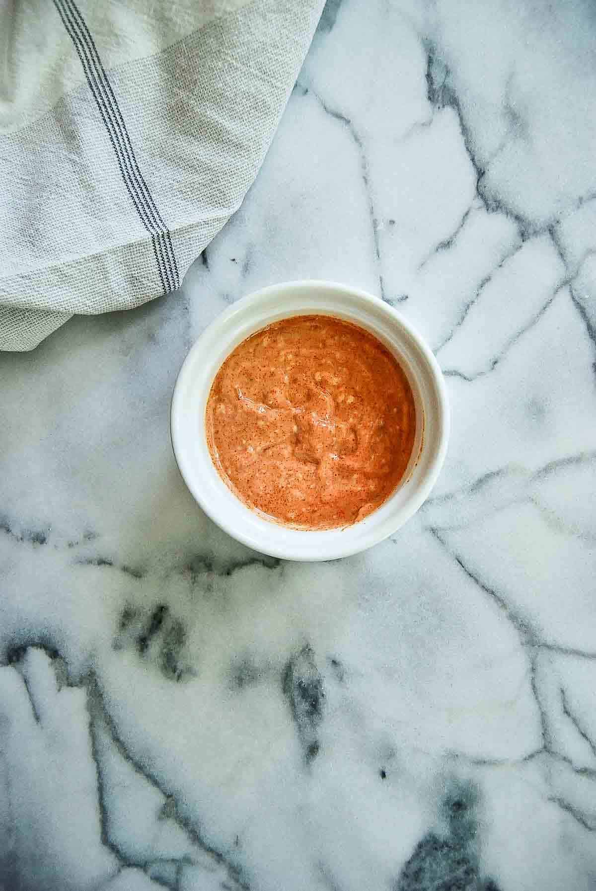 red pepper mayo in bowl on counter.