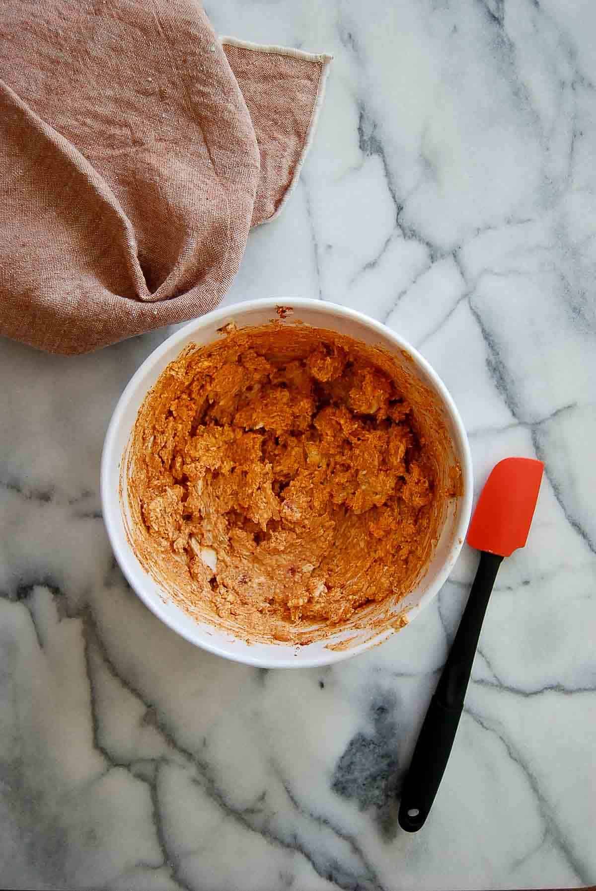 cream cheese mixture with cajun seasoning in bowl.